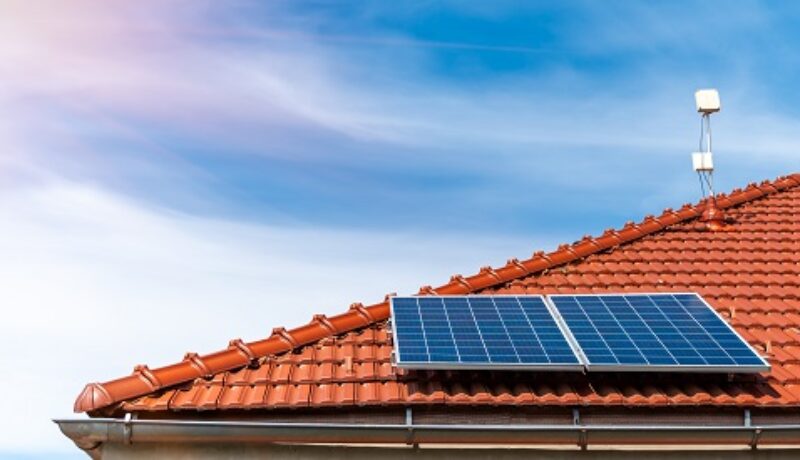 solar panels on the roof of a family house